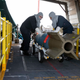 Weapons handlers handler an inert (note blue bomb casing) GBU-10 laser guided bomb on one of the few Advanced Weapon Elevators that actually works. The GBU-10 is based on the 2,000 pound general purpose bomb.